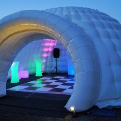 8.5m inflatable igloo bar at dusk with lights